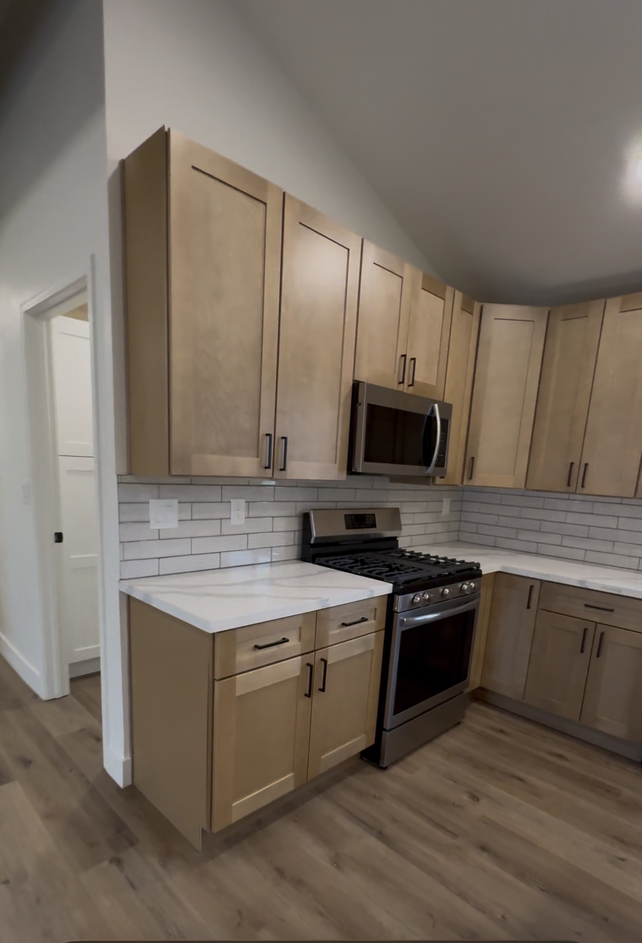 Kitchen remodel with shaker cabinets and tile backsplash